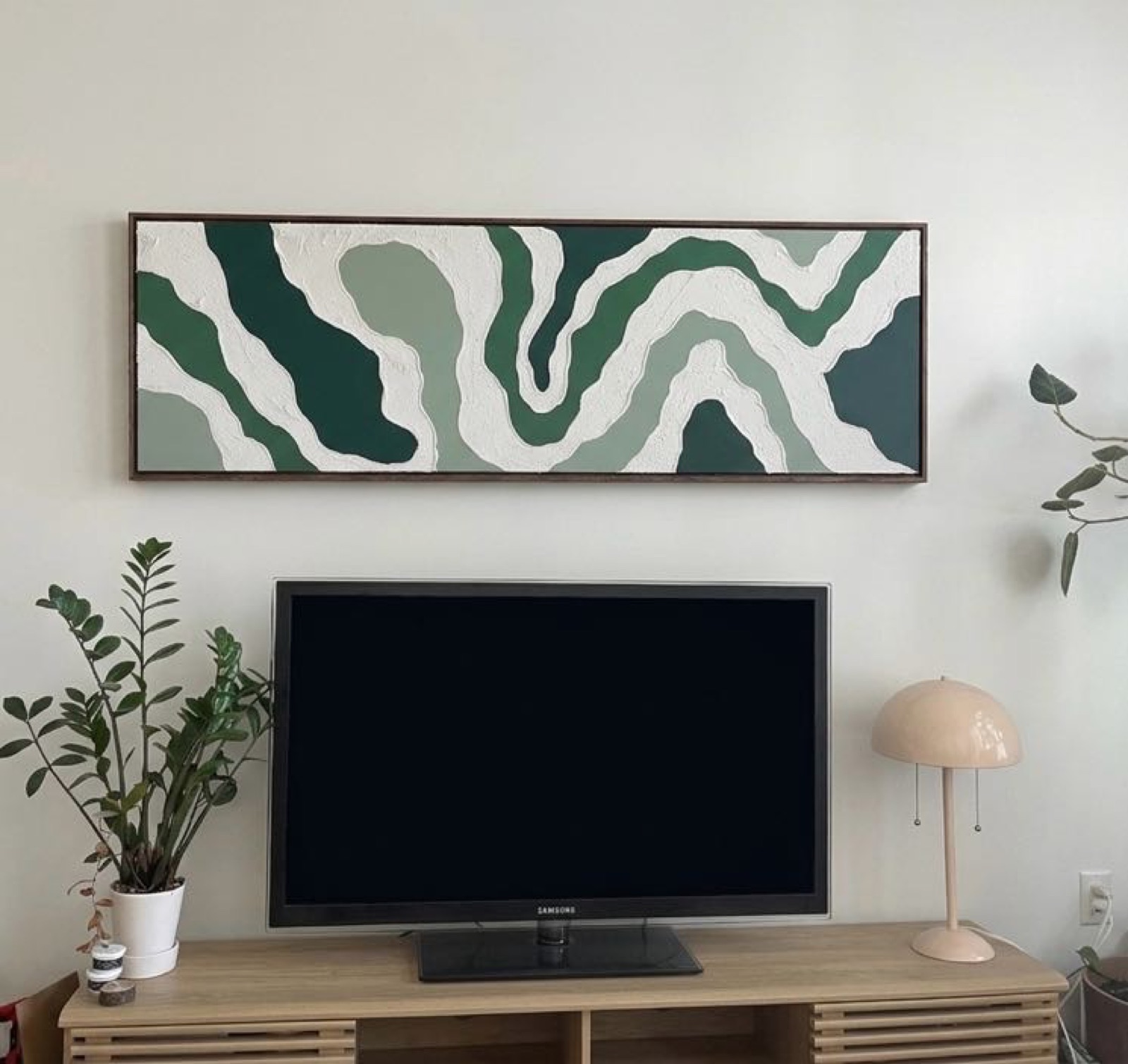 Textured relief painting by Nate Stegemiller in a styled room